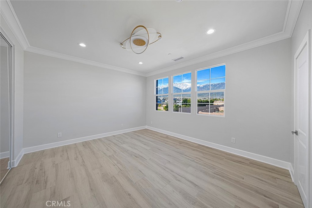 13705 Copley Drive Rancho Cucamonga, CA 91739 - Photo 13 of 13 wooden floor in an empty room with a window