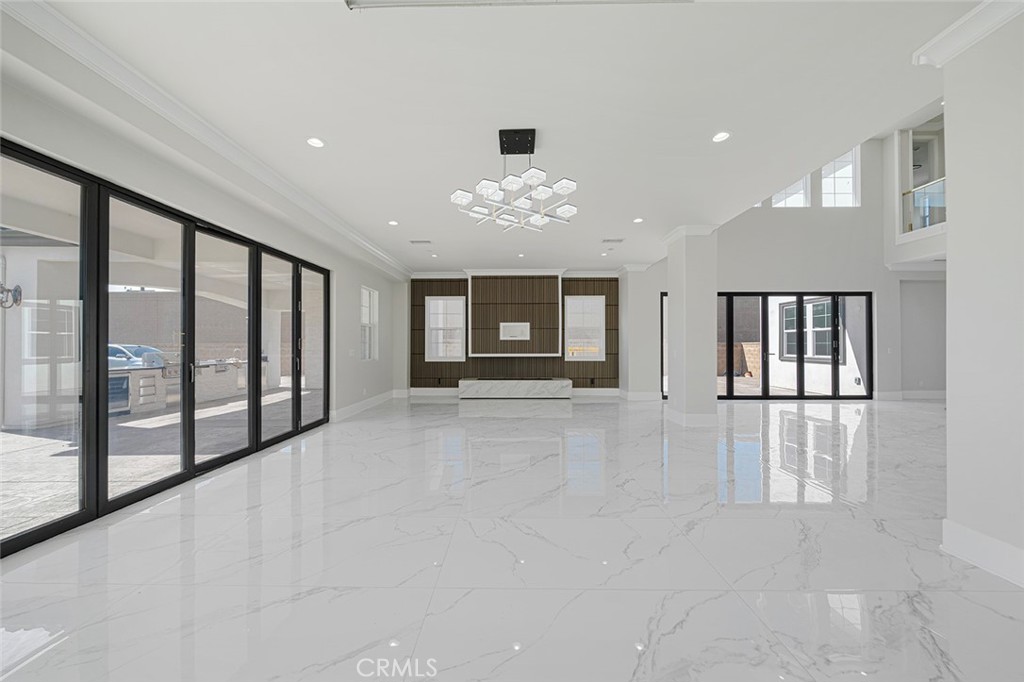 13705 Copley Drive Rancho Cucamonga, CA 91739 - Photo 5 of 13 a view of an empty room with window and cabinet