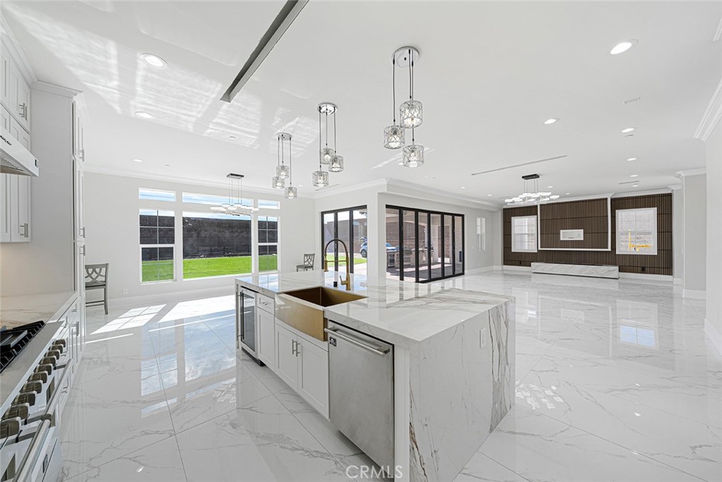 13705 Copley Drive Rancho Cucamonga, CA 91739 - Photo 7 of 13 a large white kitchen with a large window