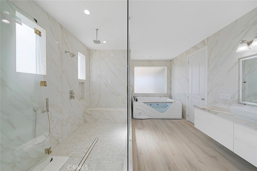 13705 Copley Drive Rancho Cucamonga, CA 91739 - Photo 9 of 13 a bathroom with a glass shower door and a sink
