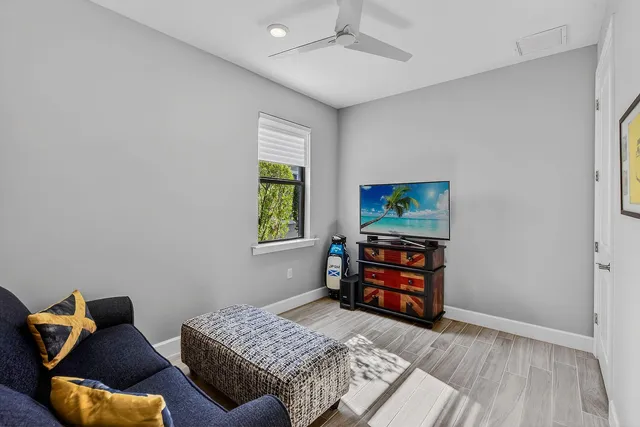 a bedroom with furniture and a window