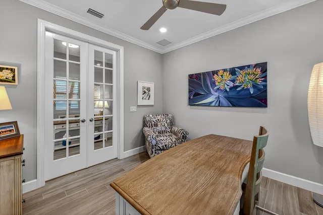 a bedroom with furniture and wooden floor
