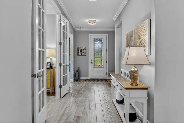 a room with a bed and a mirror