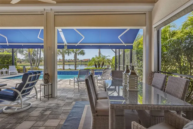 a view of a dining room with furniture window and outside view