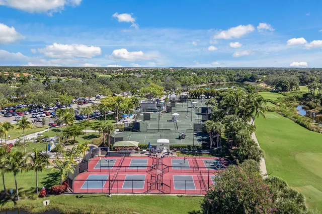 a view of a city with lots of residential buildings ocean and mountain view in back