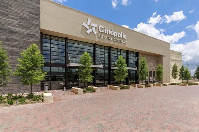 a view of a building with sitting area