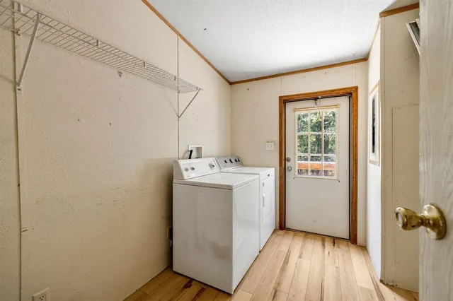 a utility room with closet dryer and washer