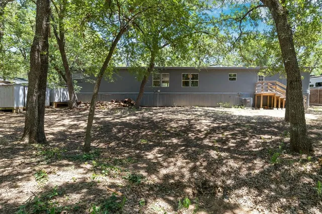 a backyard of a house with lots of green space