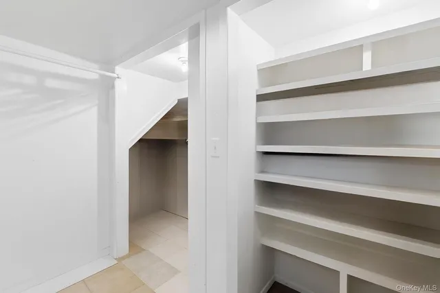 a view of an empty walk in closet