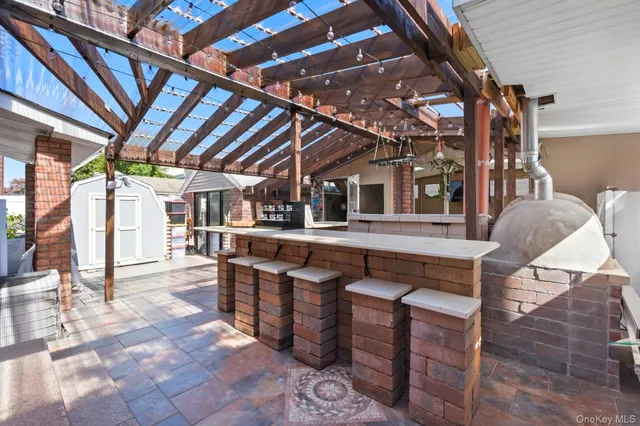 a dinning room with kitchen island a table and chairs in it