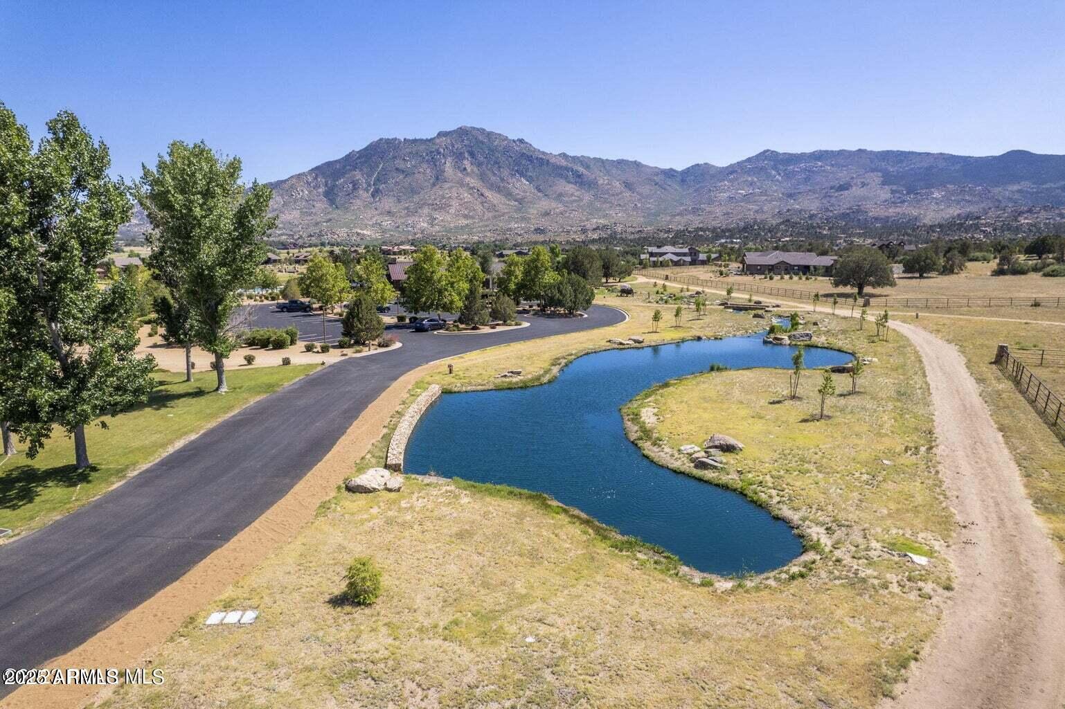 4755 Phantom Hill Road, Unit 163 Prescott, AZ 86305 - Photo 14 of 14 a view of a swimming pool with a lake view