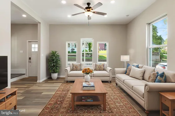 a living room with furniture and windows