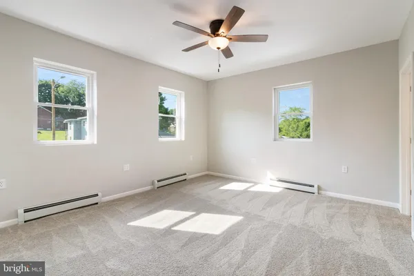 a view of an empty room with a window