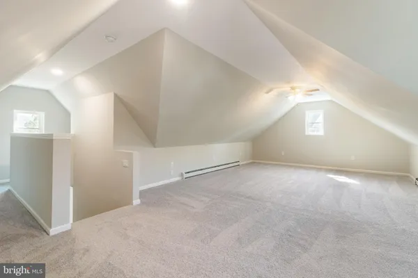 an empty room with windows and entrance