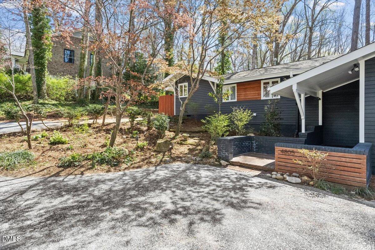 4805 Rembert Drive Raleigh, NC 27612 - Photo 36 of 45 a view of a house with a yard and tree s