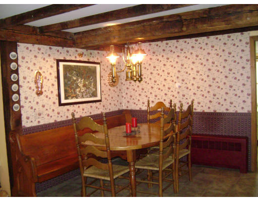 651 S Road Templeton, MA 01468 - Photo 6 of 22 a view of a dining room with furniture and chandelier