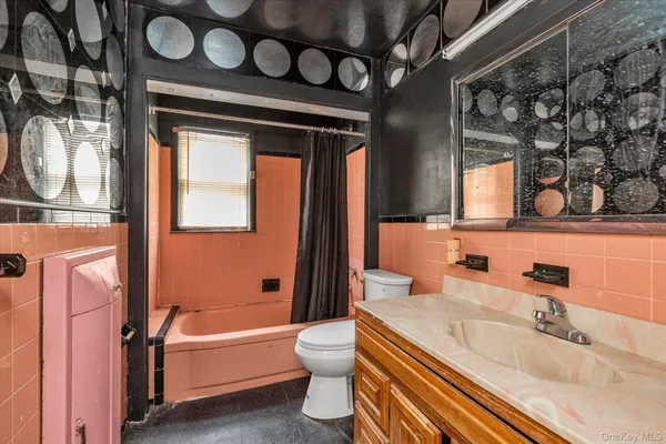 a bathroom with a sink a toilet and a tub