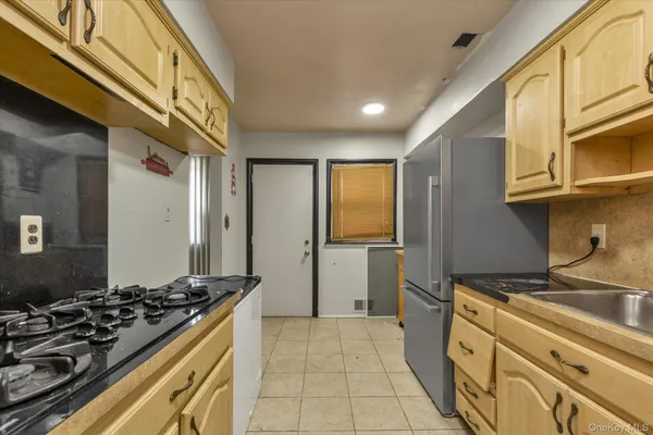 a kitchen with a stove and a sink