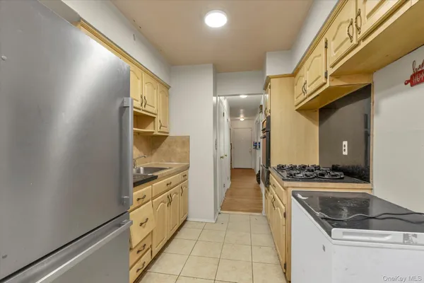 a kitchen with a stove and a refrigerator