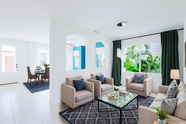 a living room with furniture and a large window