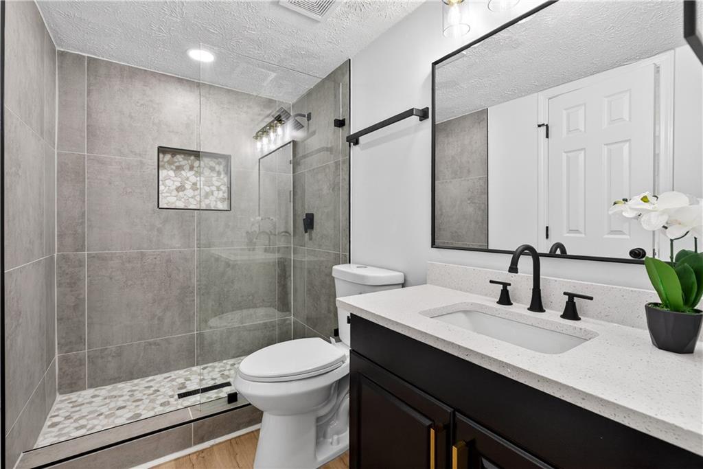 170 Kipling Way Riverdale, GA 30274 - Photo 11 of 16 a bathroom with a sink a toilet and shower