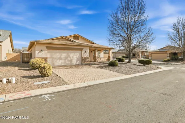 a front view of a house with a outdoor space