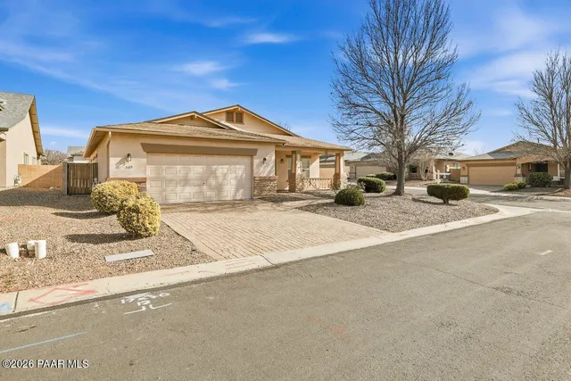 a front view of a house with a outdoor space