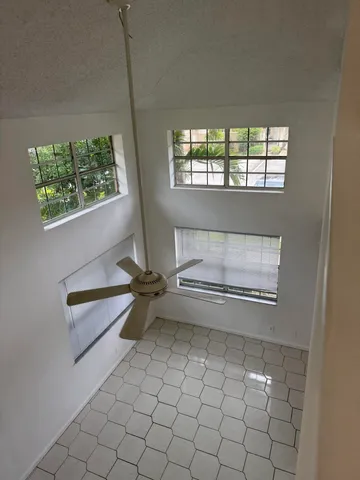 a living room with a wooden floor and a table