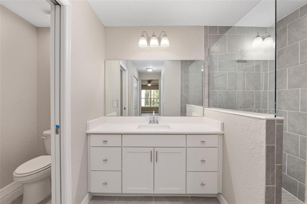 21010 Southwest 102nd Street Road Dunnellon, FL 34431 - Photo 16 of 47 a bathroom with a sink and a mirror