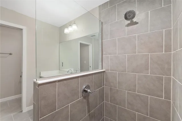 a bathroom with a shower and a sink