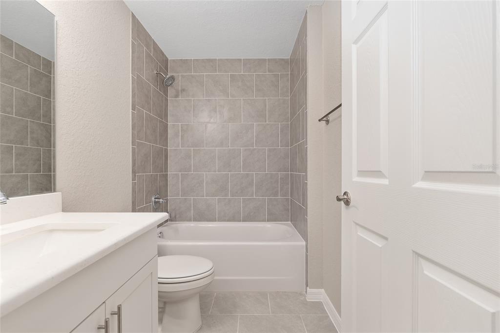 21010 Southwest 102nd Street Road Dunnellon, FL 34431 - Photo 24 of 47 a bathroom with a sink a toilet and bathtub