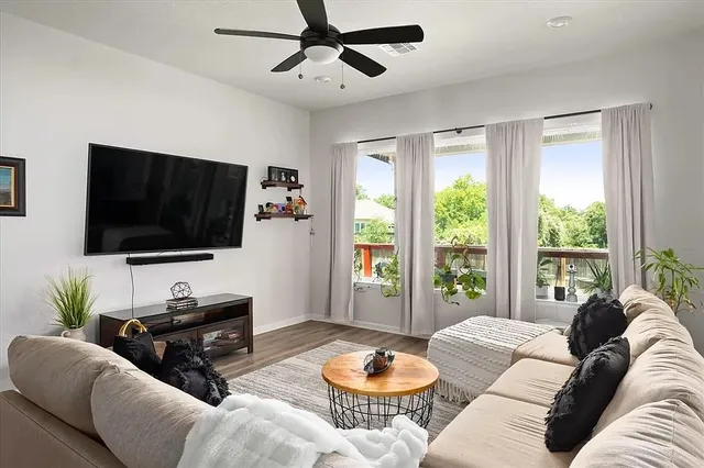 a view of a dining room with furniture and a window