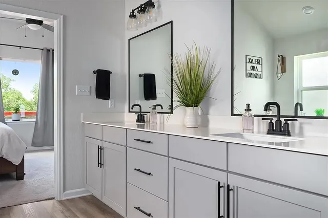 a view of a bedroom with a bed and glass door