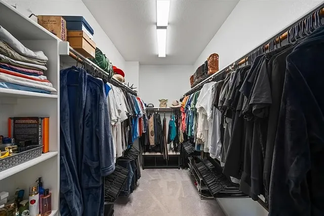 a bathroom with double vanity sink a mirror and shower