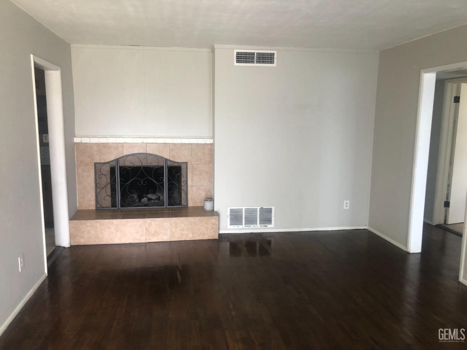 Undisclosed Address Bakersfield, CA 93308 - Photo 11 of 11 a living room with a fireplace