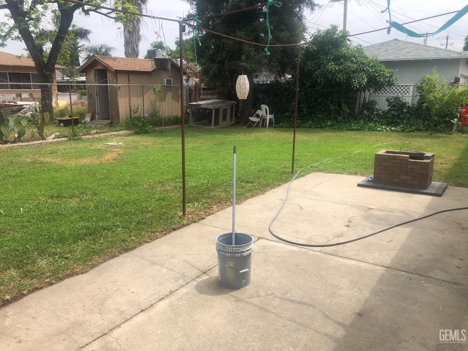 Undisclosed Address Bakersfield, CA 93308 - Photo 9 of 11 a backyard of a house with barbeque oven