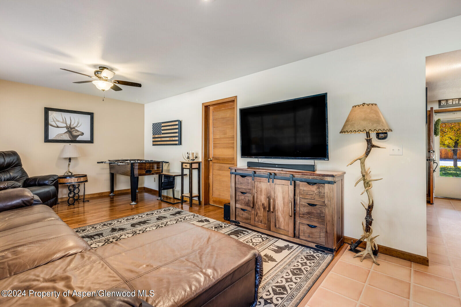 176 Rabbit Road Carbondale, CO 81623 - Photo 16 of 29 a living room with furniture and a flat screen tv
