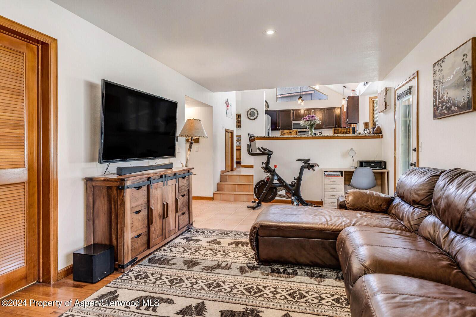 176 Rabbit Road Carbondale, CO 81623 - Photo 17 of 29 a living room with furniture and a flat screen tv