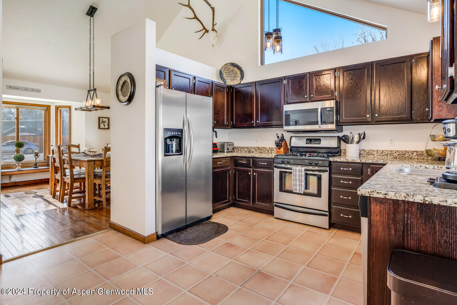 176 Rabbit Road Carbondale, CO 81623 - Photo 19 of 29 a kitchen with stainless steel appliances granite countertop a stove a refrigerator and a sink