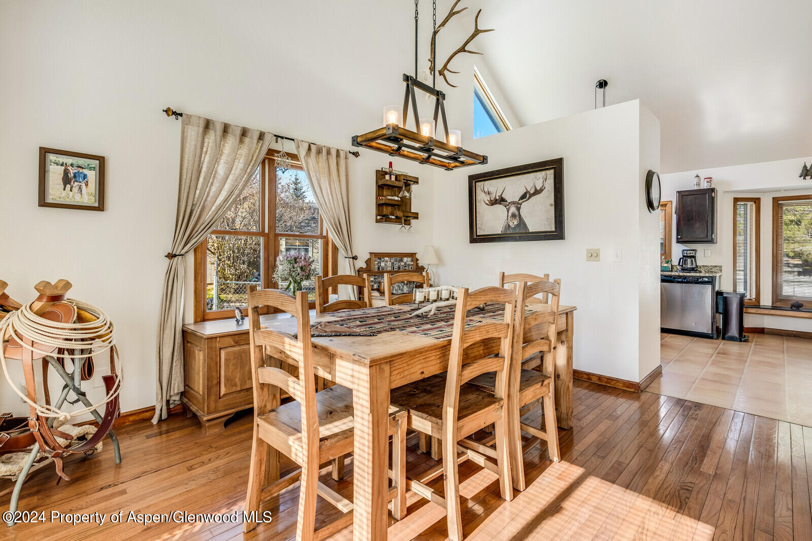176 Rabbit Road Carbondale, CO 81623 - Photo 21 of 29 a view of a dining room with furniture wooden floor and a rug
