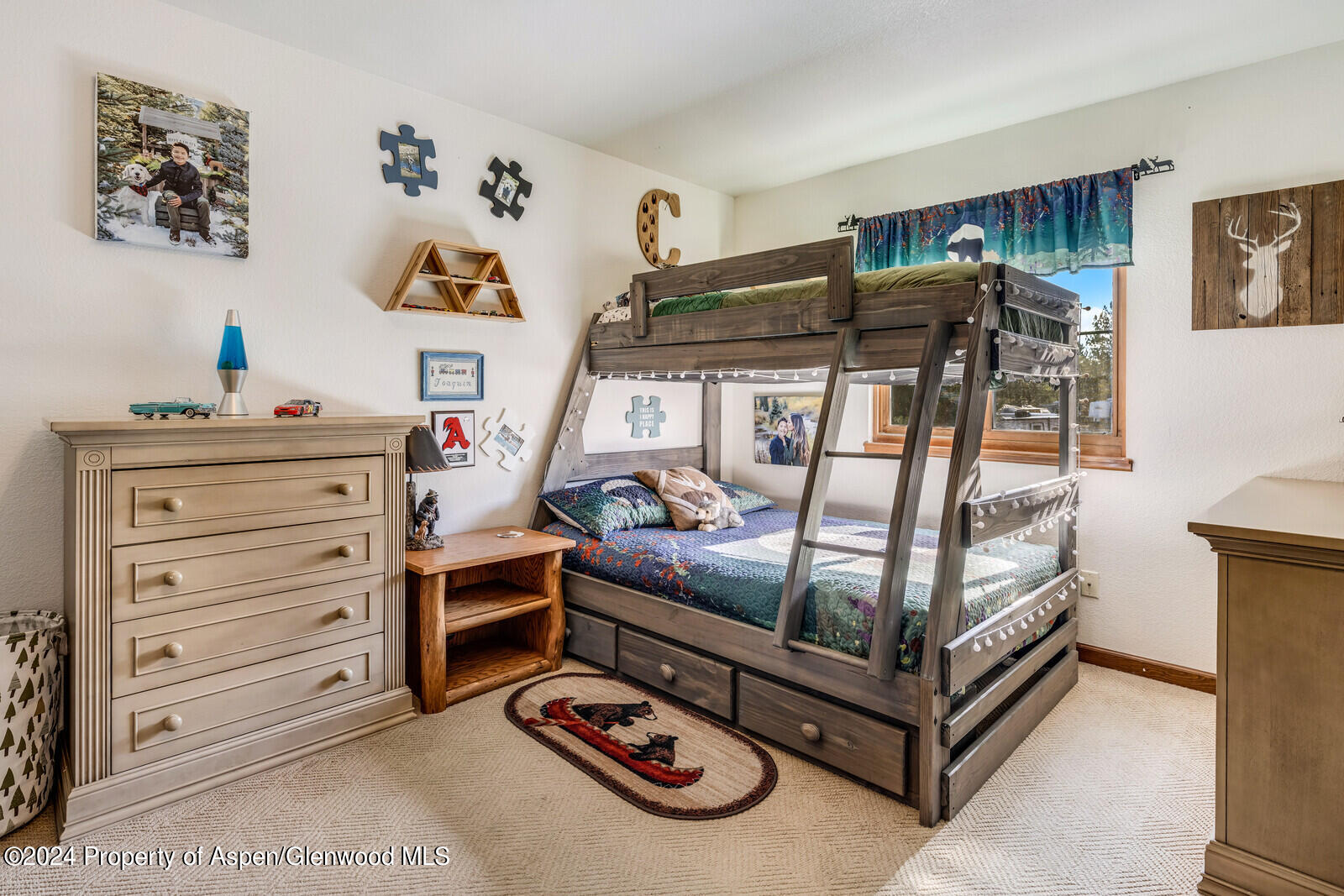 176 Rabbit Road Carbondale, CO 81623 - Photo 27 of 29 a bedroom with a bunk bed window and a dresser