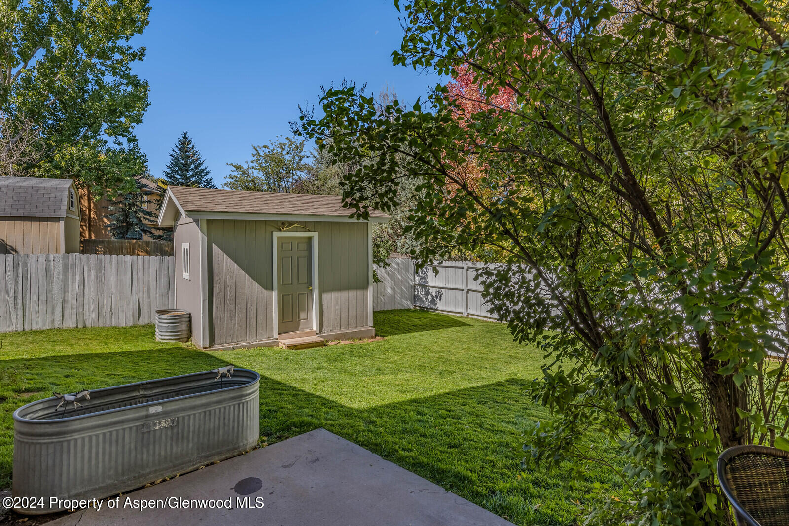 176 Rabbit Road Carbondale, CO 81623 - Photo 6 of 29 a view of a backyard with couches plants and large trees