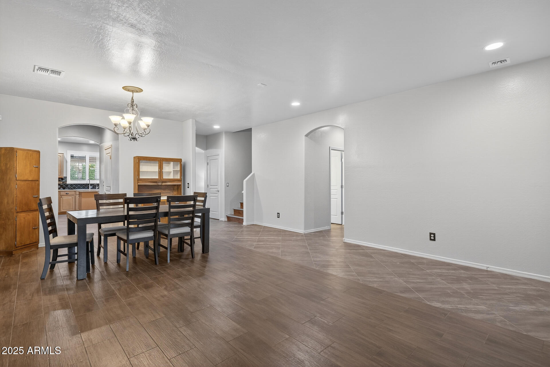 28305 North Desert Native Street San Tan Valley, AZ 85143 - Photo 11 of 81 a view of a dining room with furniture and chandelier
