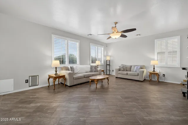 a bathroom with a tub shower and hallway