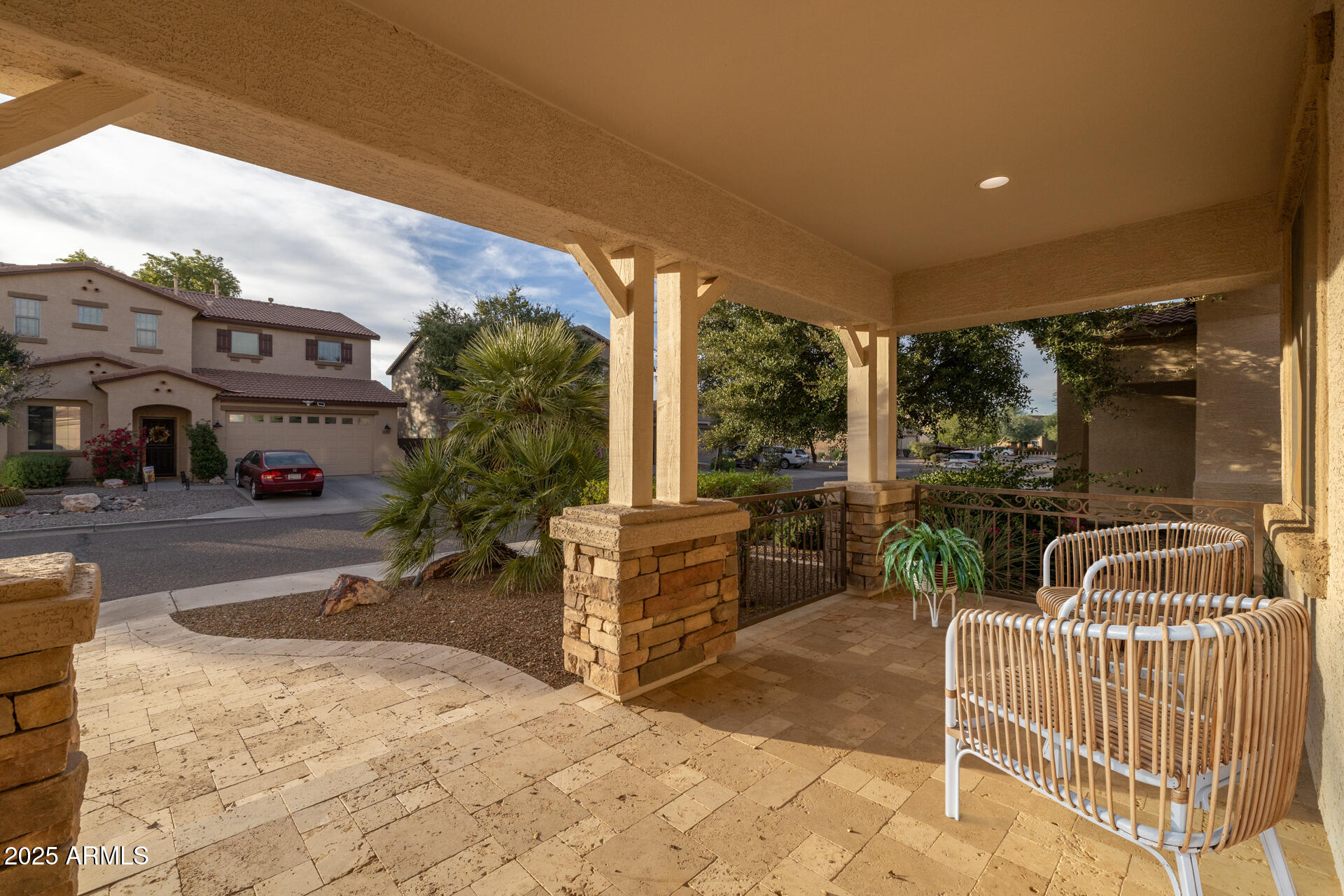 28305 North Desert Native Street San Tan Valley, AZ 85143 - Photo 4 of 81 a view of a patio with couches and table and chairs and potted plants