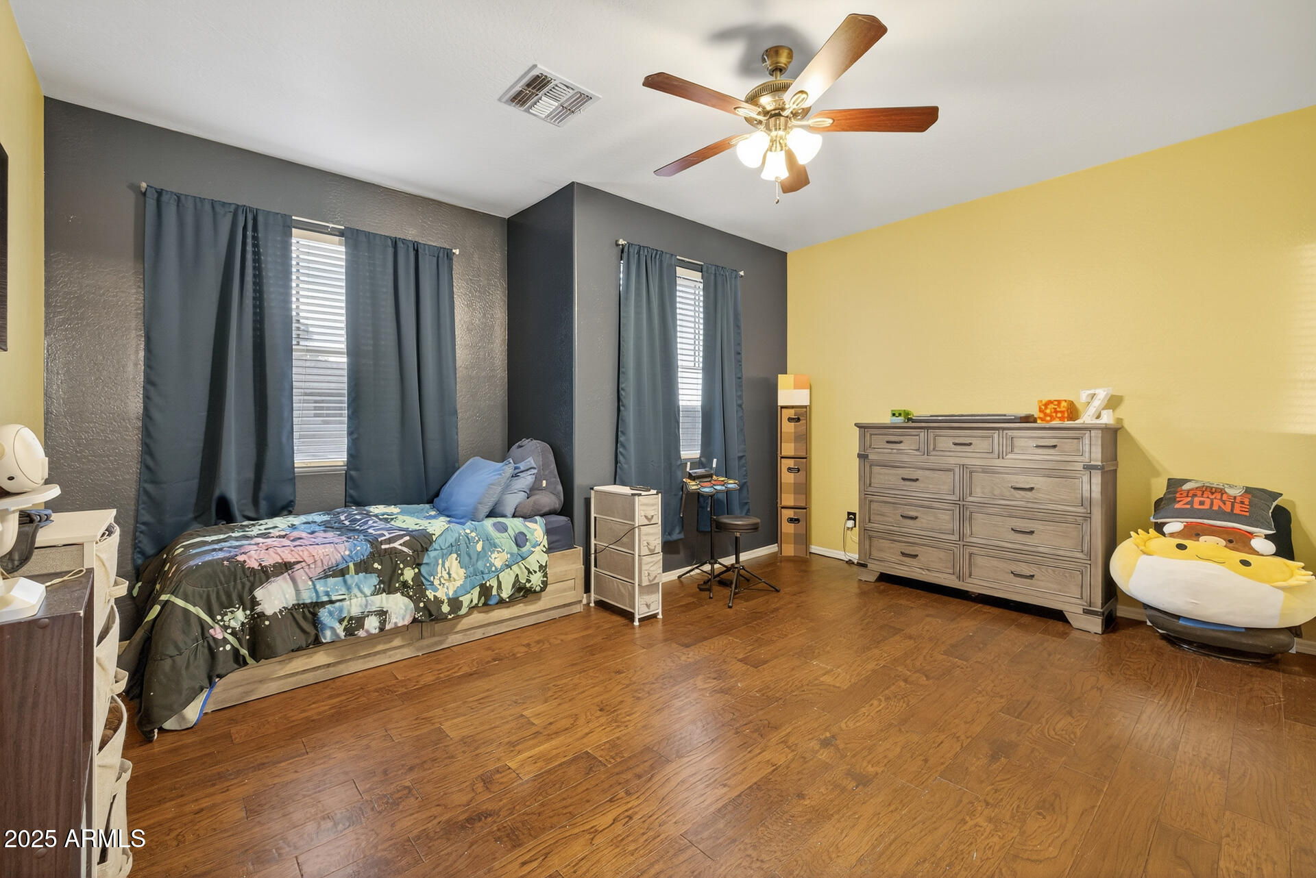 28305 North Desert Native Street San Tan Valley, AZ 85143 - Photo 43 of 81 a bedroom with a bed and a chandelier