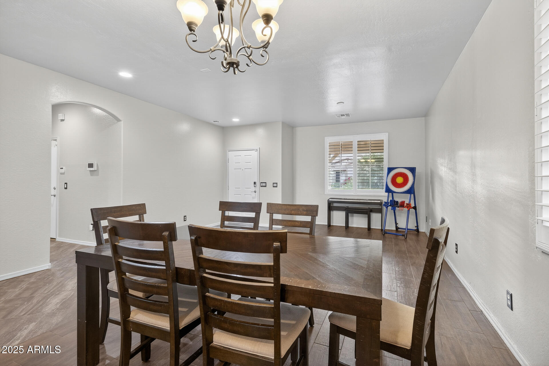 28305 North Desert Native Street San Tan Valley, AZ 85143 - Photo 8 of 81 a view of a dining room with furniture and wooden floor