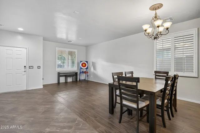 a kitchen with refrigerator cabinets and wooden floor
