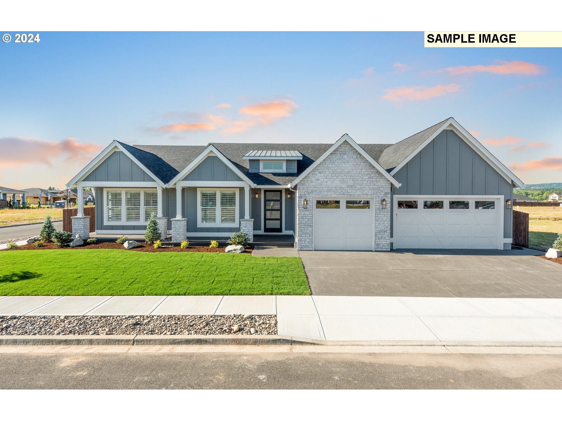 Northeast 178th Circle, Unit LOT11 Ridgefield, WA 98642 - Photo 1 of 30 a view of a big house with a big yard and large trees