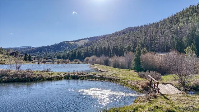 a view of a backyard with a table and chair